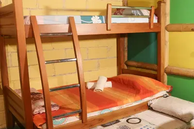 a set of bunk beds in a room at Eco posada El Encuentro San Carlos frente al rio in San Carlos