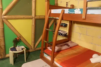 a room with a bunk bed in a house at Eco posada El Encuentro San Carlos frente al rio in San Carlos