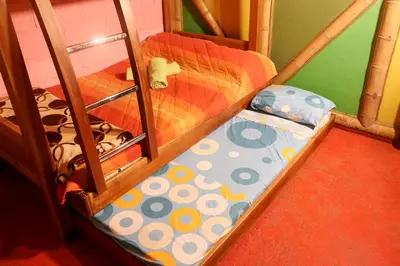 a childs bunk bed in a room with a bunk bedructivenessangering at Eco posada El Encuentro San Carlos frente al rio in San Carlos