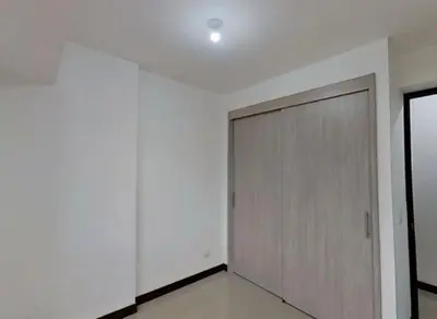 a hallway with a door in a white room at Hospedaje, Nórdica,Medellin,Turosmocolombia-fit in Bello
