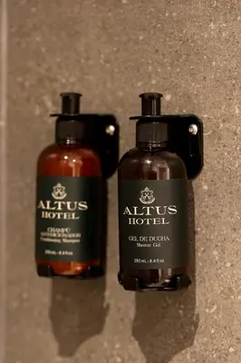 two bottles of hair products sitting on a counter at Altus Hotel in Medellín