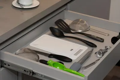 a drawer filled with utensils in a kitchen at Altus Hotel in Medellín