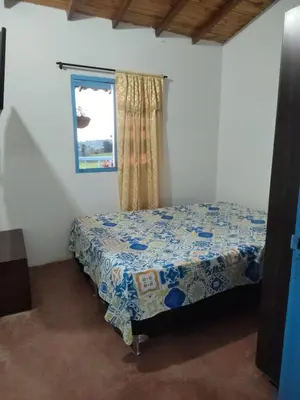 a bedroom with a bed in a room with a window at Lactesano es Vida in La Unión