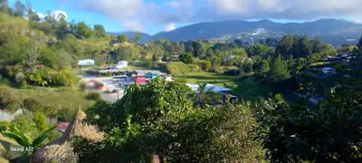 an aerial view of a village with trees and houses at Chalet MA in Guatapé