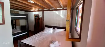 a bedroom with a bed with a mirror at Casa de Campo MA in Chiquinquirá