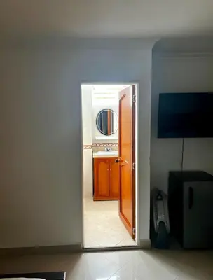 an open door to a kitchen in a room at Hotel Restaurante La Costica Dulce in San Carlos