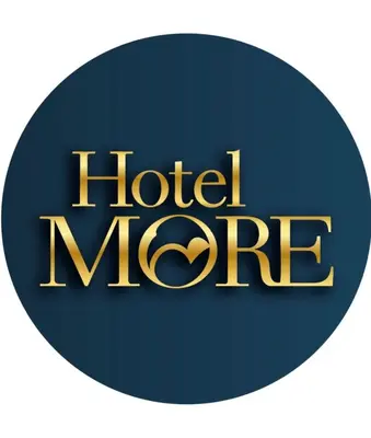 a blue and gold hotel logo on a white background at Hotel y Restaurante More in Supía