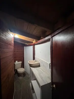 a bathroom with a sink and a toilet at Cabaña Privada Pachamama Ancestral in Medellín