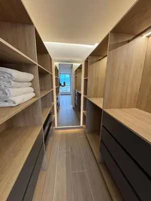 a room with wooden shelves and a hallway at El Poblado Amazing Penthouse with Breathtaking Views in Medellín