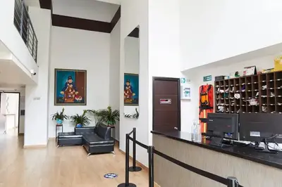 a lobby with a bar and a couch in a building at Apartamentos La Frontera in Medellín