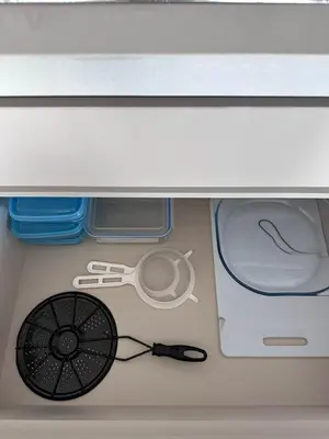 a drawer with a pair of scissors and an umbrella at Sabaneta, aparta Loft, excelente Ubicacion, Wifi in Sabaneta