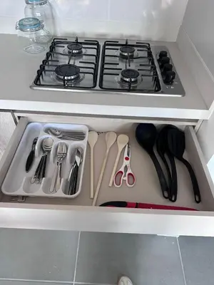 a kitchen drawer with a stove and some utensils at Sabaneta, aparta Loft, excelente Ubicacion, Wifi in Sabaneta