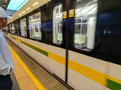 a man waiting for a train at a subway station at Quiet space near Nórdica with parking in Bello