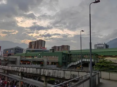 a bridge with a green building in a city at Quiet space near Nórdica with parking in Bello
