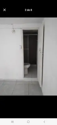 a bathroom with a toilet in a white room at Casa estrella in Manizales