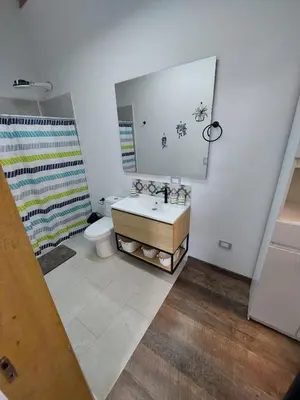 a bathroom with a sink and a toilet at El Encanto - El Peñol in Chiquinquirá