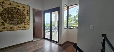 an empty room with a door and a balcony at El Encanto - El Peñol in Chiquinquirá