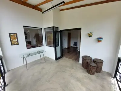 an empty room with a table and some chairs at El Encanto - El Peñol in Chiquinquirá
