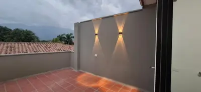 a room with a wall with lights on it at Apartamento en Santa Fe de Antioquia con jacuzzi in Santa Fe de Antioquia