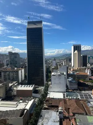 a view of a city with a tall building at As Seen On Netflix NARCO house in Medellín