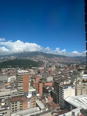 an aerial view of a city with buildings at As Seen On Netflix NARCO house in Medellín