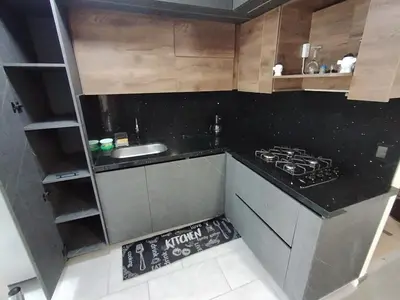 a small kitchen with a sink and a stove at Confortable Apartamento cerca Aerop JMC in Rionegro
