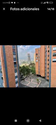a view of a tennis court in front of buildings at Apartamento en excelente ubicación en el Poblado para renta con estadía mínima de 1 mes in Medellín