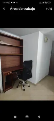 a office with a desk and a chair in a room at Apartamento en excelente ubicación en el Poblado para renta con estadía mínima de 1 mes in Medellín