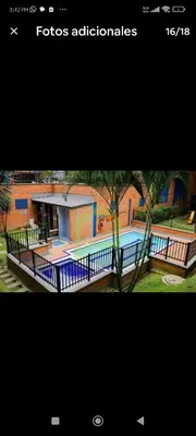 a picture of a house with a swimming pool at Apartamento en excelente ubicación en el Poblado para renta con estadía mínima de 1 mes in Medellín