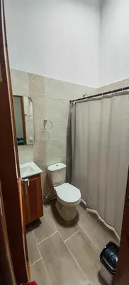 a bathroom with a toilet and a sink and a shower at La Isabella - Descanso & Naturaleza in Estación El Salto