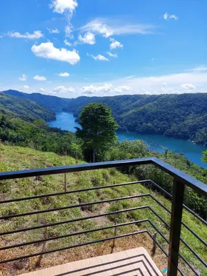 a view of a river from a lookout on a hill at Cabaña Refugio Amani in Norcasia