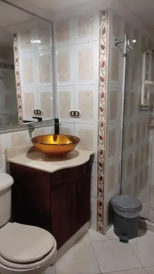 a bathroom with a sink and a toilet and a shower at Habitación central con cama doble #1 in Medellín