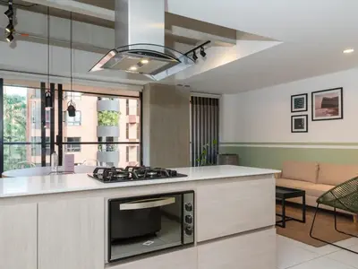 a kitchen with a stove top oven in a room at NOK Spectacular 3 BR w Balcony in Laureles Medellin in Medellín