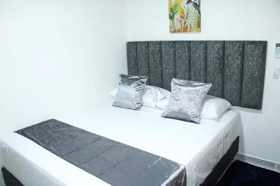 a bed with two pillows on it in a room at Pura Vida in Quibdó