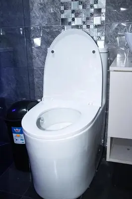 a white toilet with the lid up in a bathroom at Pura Vida in Quibdó
