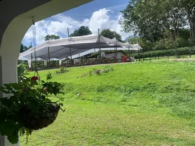 a large white tent in a field of grass at Finca Hotel El Juncal in Venecia