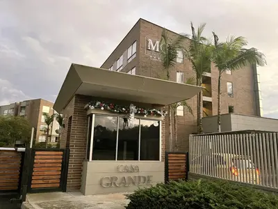a can grande building with a sign in front of it at Private 1BR 2Bed AC Suite | Llanogrande Airport in Rionegro