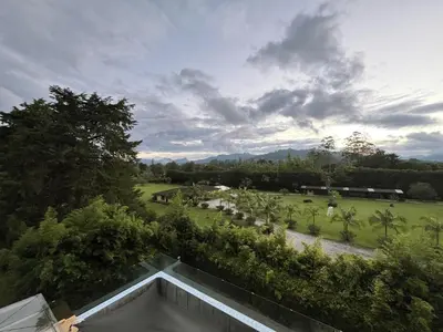 a view of a park with trees and a building at Private 1BR 2Bed AC Suite | Llanogrande Airport in Rionegro