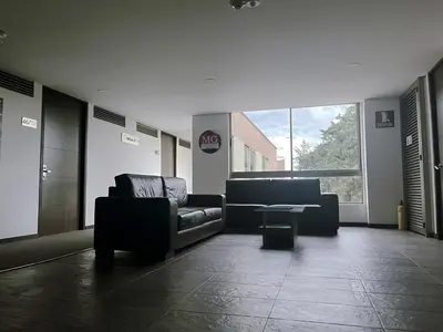a lobby with couches and a table in a building at Private 1BR 2Bed AC Suite | Llanogrande Airport in Rionegro