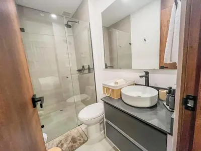 a bathroom with a toilet and a sink and a shower at Modern 2BR 3Bed Country Suite | El Retiro, Ant in El Retiro