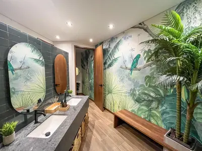 a bathroom with two sinks and a tropical mural at Modern 2BR 3Bed Country Suite | El Retiro, Ant in El Retiro