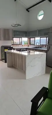 a large kitchen with a large island in the middle at Villa Adelaida in San Rafael