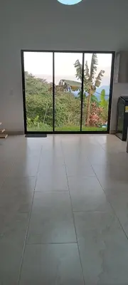 a room with three large windows and a large tile floor at Villa Adelaida in San Rafael