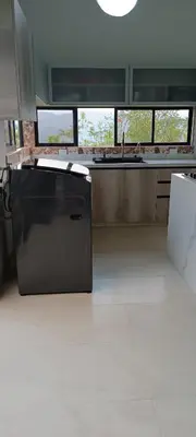 a kitchen with a refrigerator in the middle of a room at Villa Adelaida in San Rafael