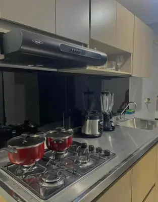 two pots and pans on a stove in a kitchen at Apartamentos SAN LUIS in San Luis