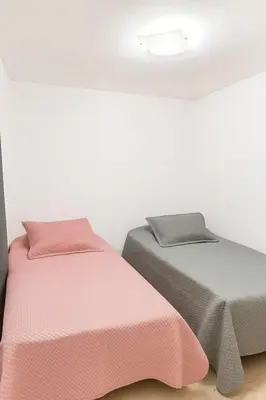 two beds sitting next to each other in a room at Oasis in Manila - El Poblado Estilo y Comfort in Medellín