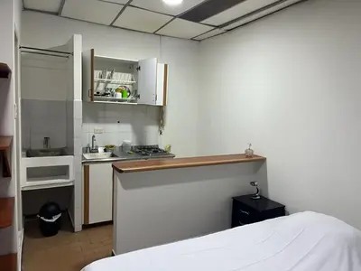 a kitchen with a sink and a counter in a room at Apartamento en el centro de Manizales in Manizales