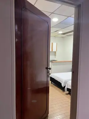 a door leading to a bedroom with a bed at Apartamento en el centro de Manizales in Manizales