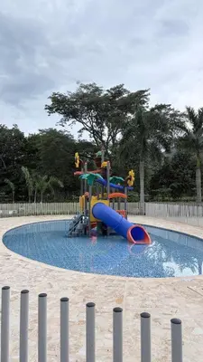 a playground with a slide in a swimming pool at Espectacular Apto Citadela Di Sole Santafe de Antioquia in Santa Fe de Antioquia
