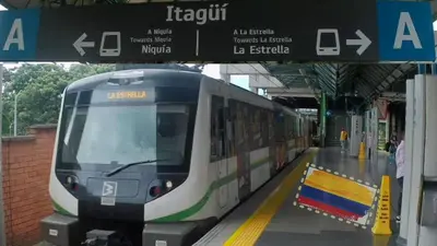 a subway train pulling into a train station at Family accommodation in downtown Itagüí in Itagüí